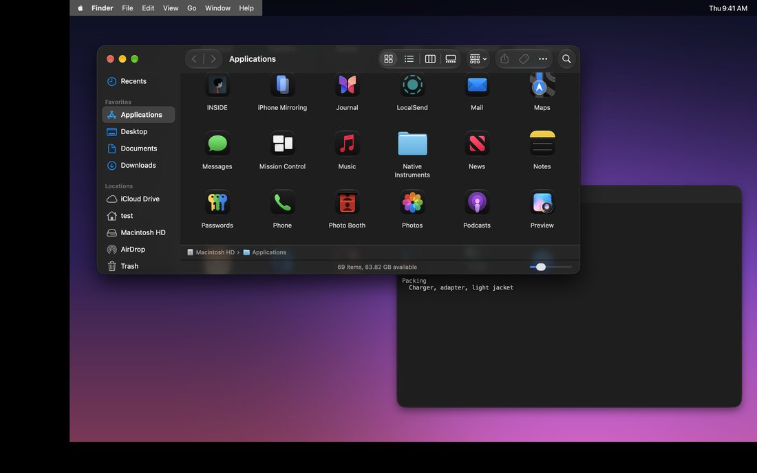 A macOS desktop with CrackMac running: black bands cover the damaged left and bottom edges, and the menu bar and windows sit inside the working part of the screen.