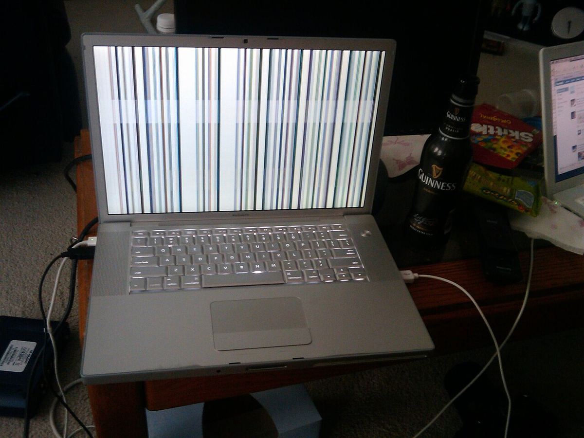 Vertical lines across an older MacBook Pro display. Lines like these can come from the panel, the display cable or the logic board, so test before you buy parts.